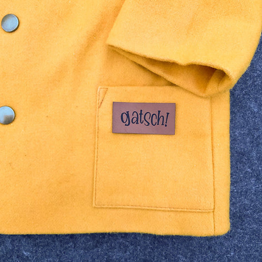 Label aus Kunstleder "Gatsch"